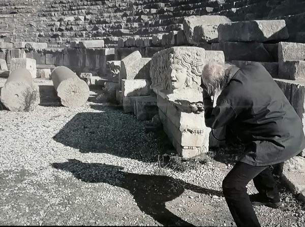 Figure 1. Magnum Photographer Joseph Koudelka caught in the act of shooting a column in the shape of a Medusa’s head, in an ancient amphitheatre in Turkey (Photo Credit: “Ruins” Exhibition, Magnum Agency 2020)