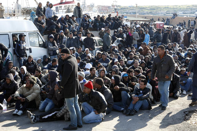 Illegal immigrants from North Africa arrive on the southern Italian island of Lampedusa